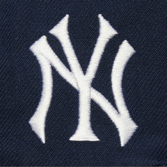Navy New York Yankees Mitchell & Ness Team Tagged Snapback Hat